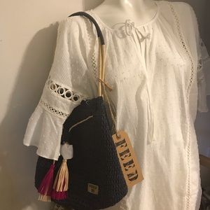 Bucket straw bag by feed